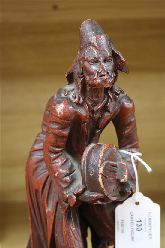 An 18th century Italian painted wood figure with a hurdy-gurdy H.29cm.